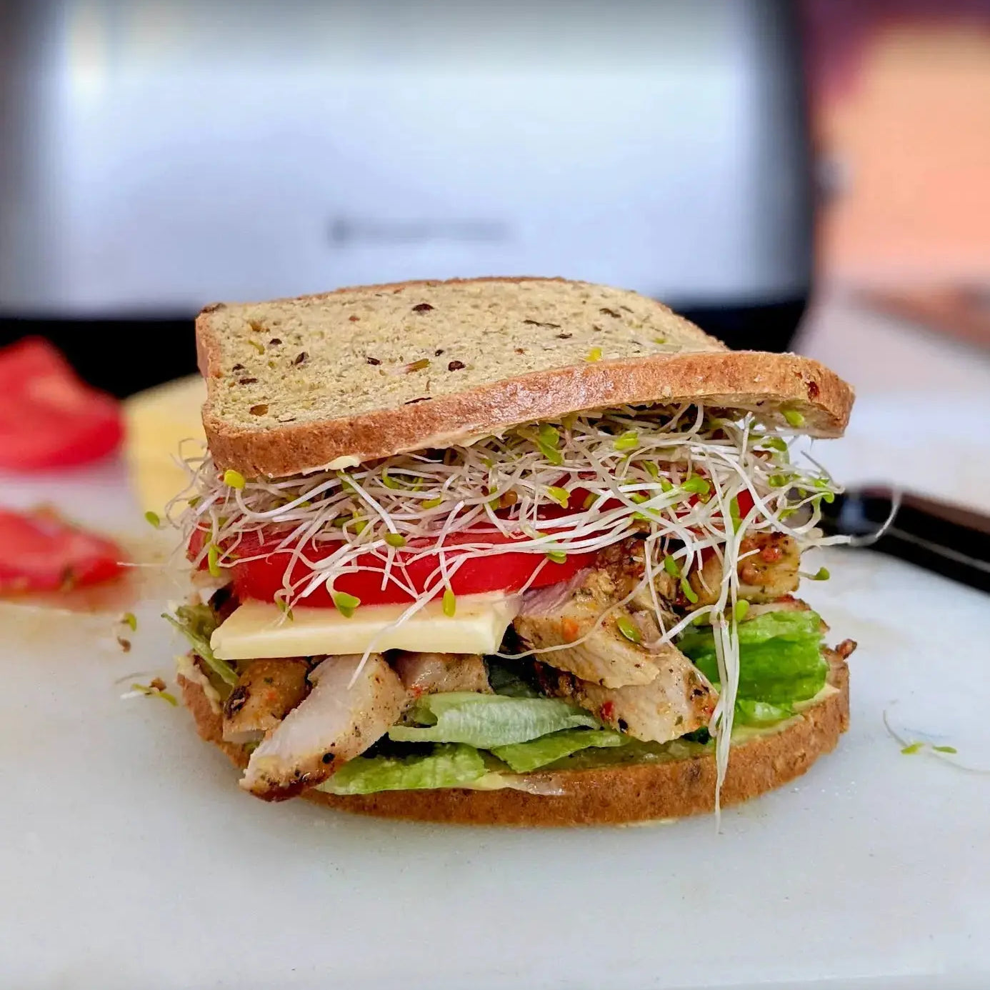 Sliced seeded bread and sandwich made from PBCO Protein 6 Seeds Bread Mix