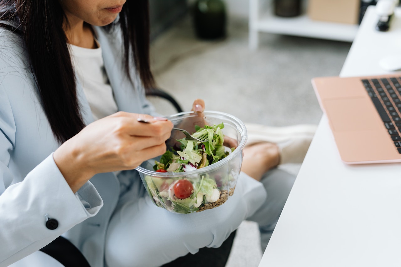 woman eating a salad