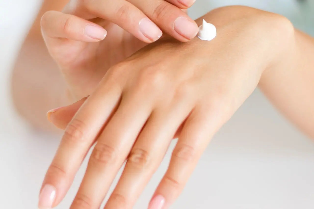 applying hand lotion