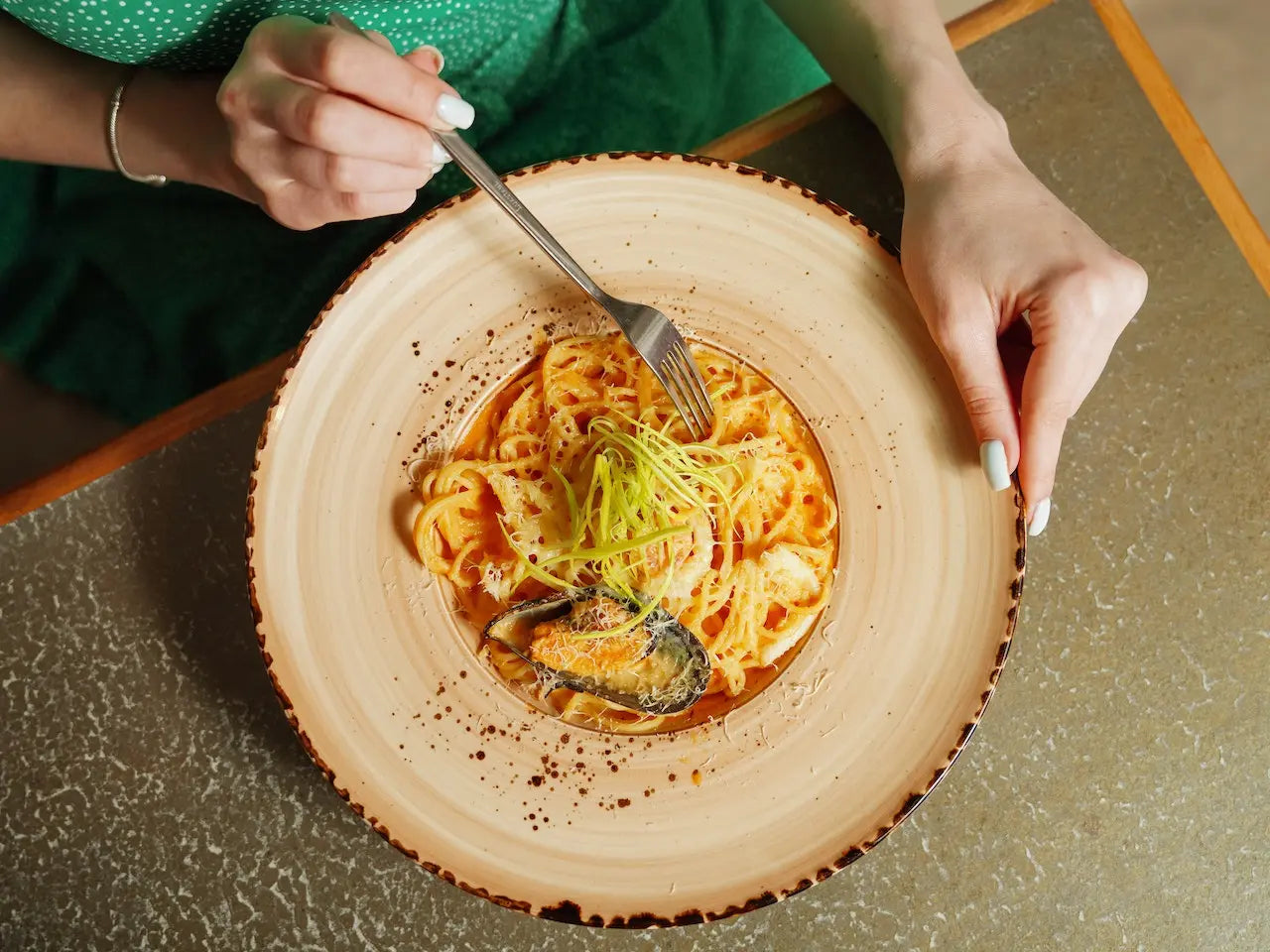 woman eating pasta