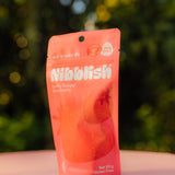 Nibblish Gently Baked Strawberry — outdoor snack lifestyle image