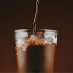 Sodii Salty Chocolate hydration drink being poured over ice
