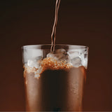 Sodii Salty Chocolate hydration drink being poured over ice