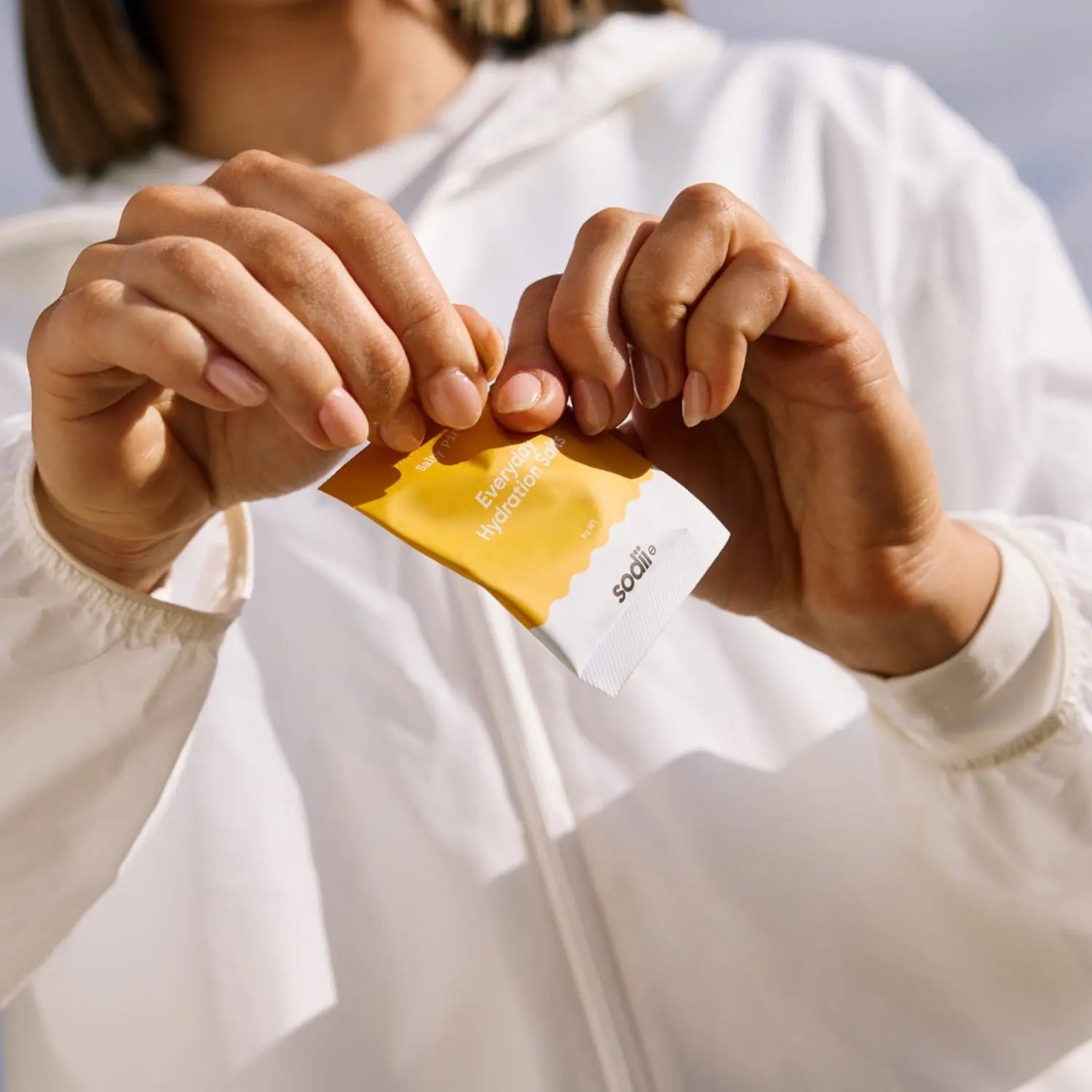 Sodii Salty Pineapple electrolyte sachet being opened