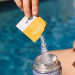 Sodii Salty Pineapple electrolyte powder poured by the pool