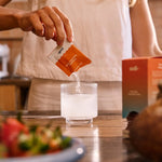 Sodii Salty Grapefruit hydration salts poured into a glass