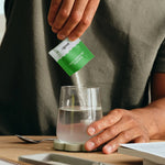 Sodii Salty Kiwi hydration salts poured into water