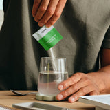 Sodii Salty Kiwi hydration salts poured into water