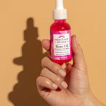 Heritage Store Rose Oil 30ml — official hand-held product lifestyle image