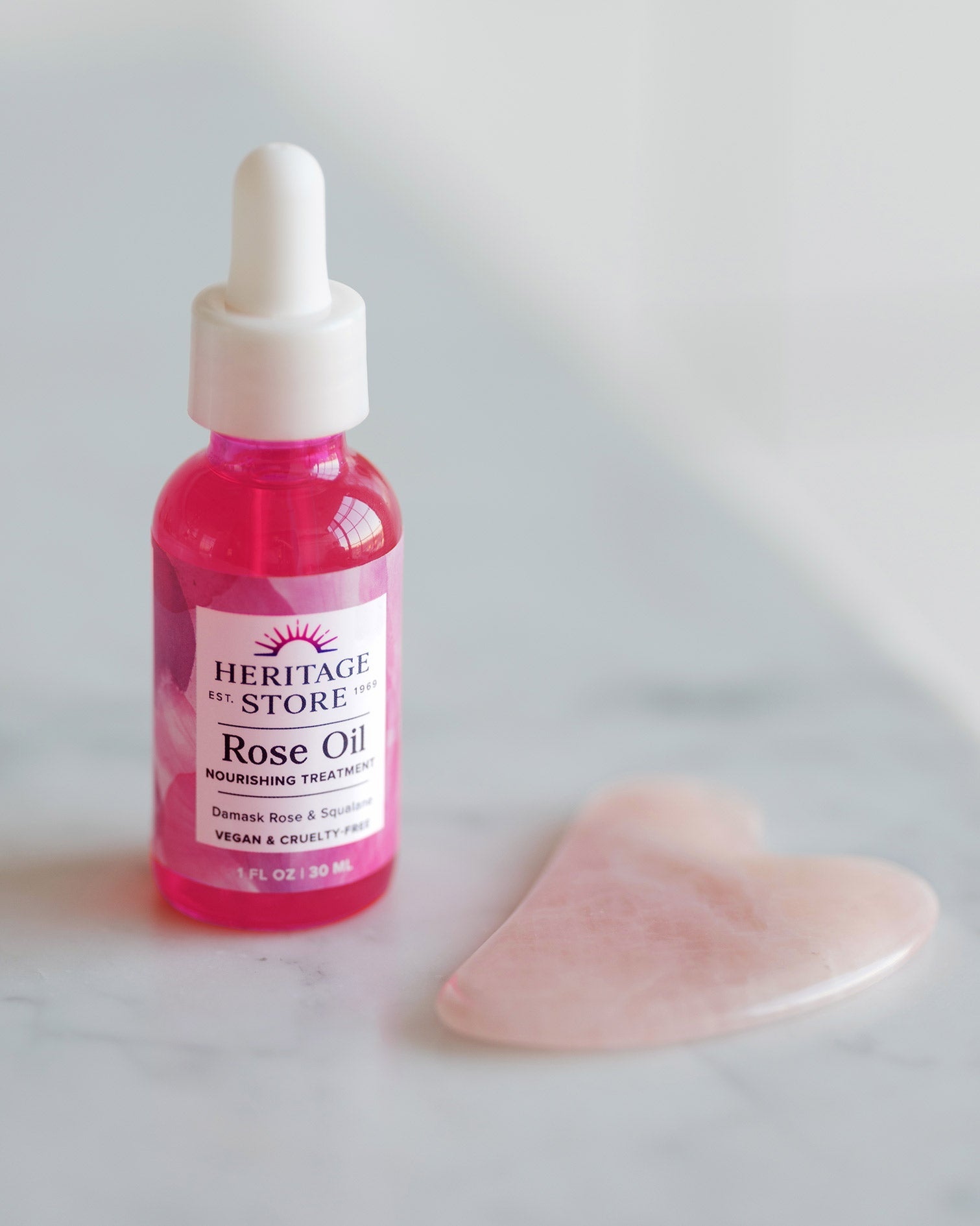 Heritage Store Rose Oil 30ml — official styled product and gua sha lifestyle image