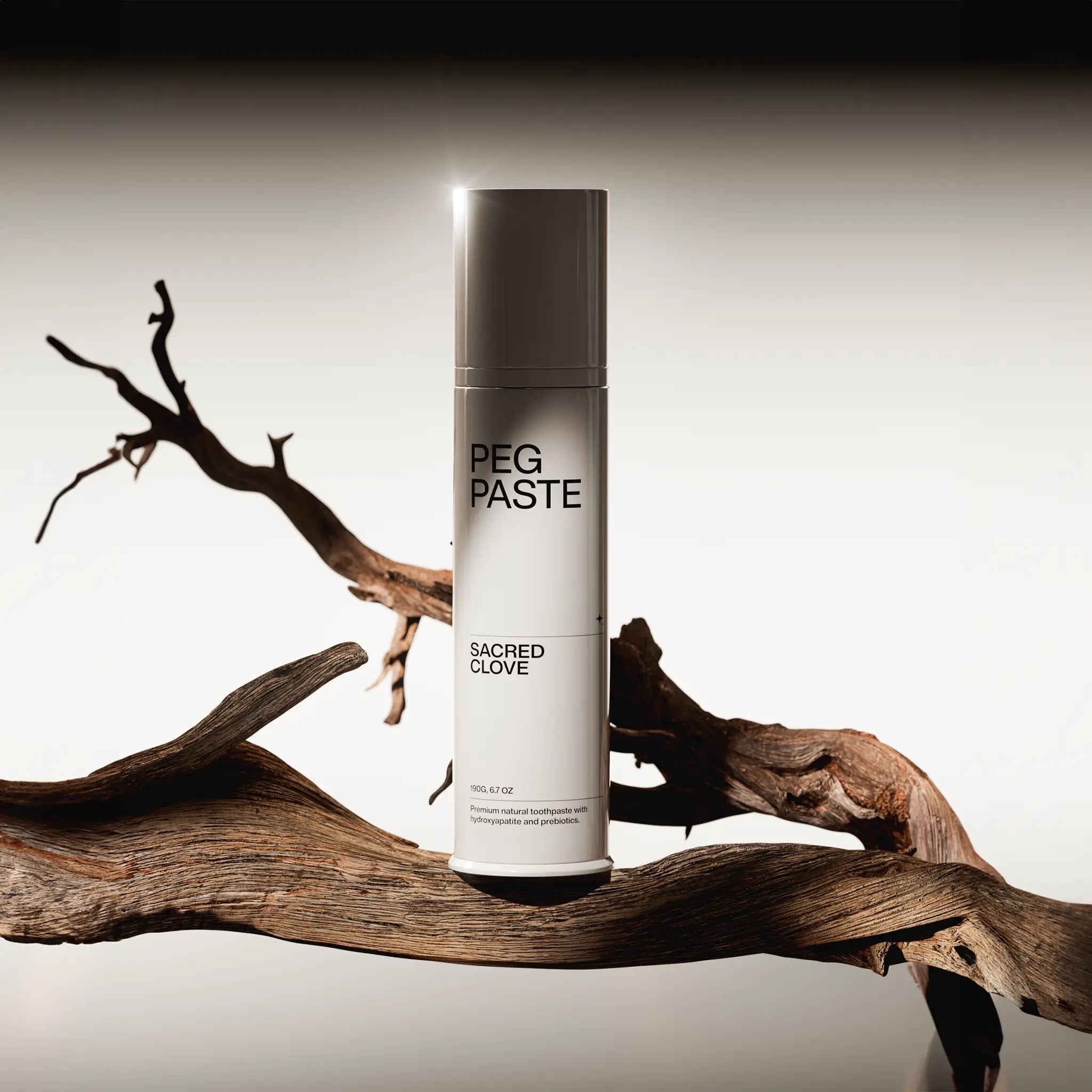 Peg Paste Sacred Clove toothpaste in a styled botanical setting