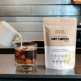 Not Coffee Vanilla 120g — iced coffee milk pour lifestyle image
